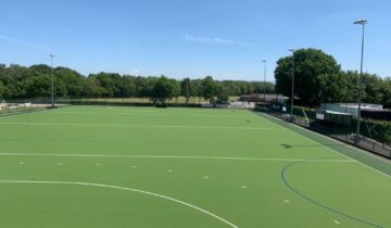 Artifical pitch with stand and floodlighting